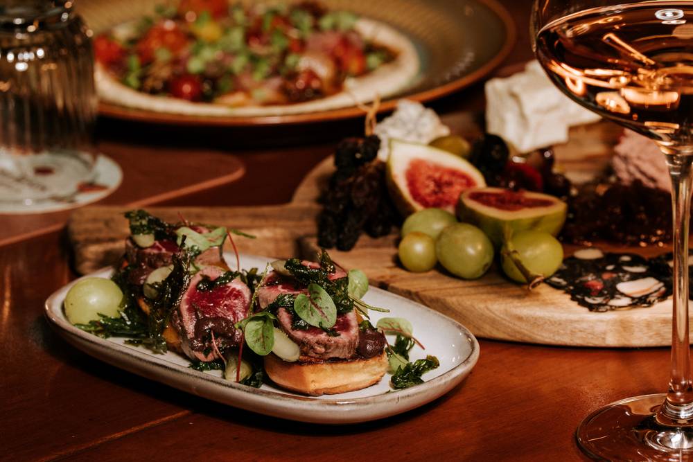 The dining room at Aranya Acres set for an evening service, Wamboin NSW